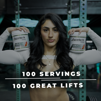 Woman holding two containers of Archaneon Supplements preworkout with gym equipment in the background